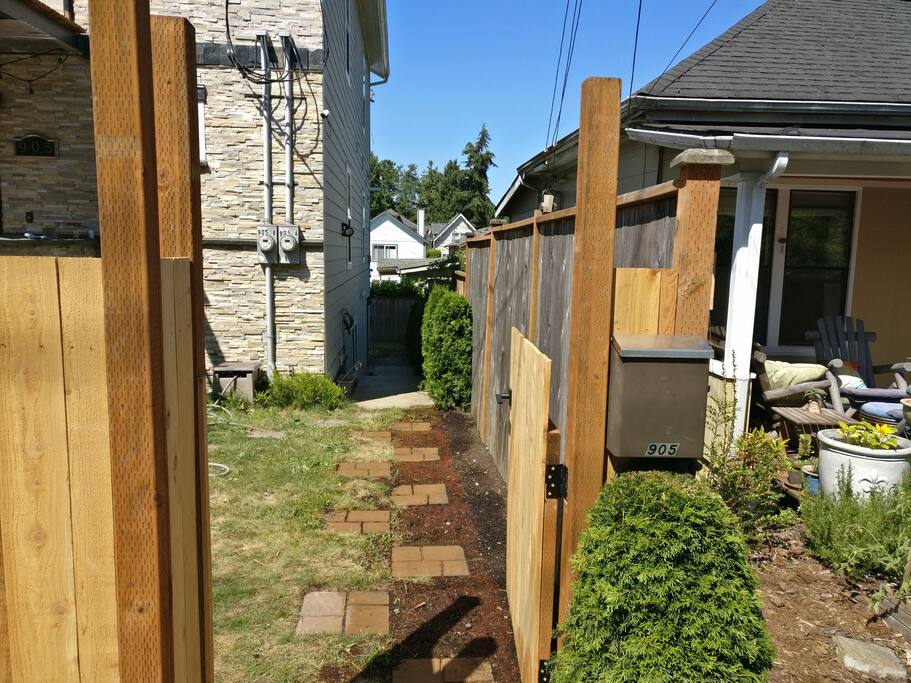 Side path to unit. Entry door is down a couple steps straight ahead.