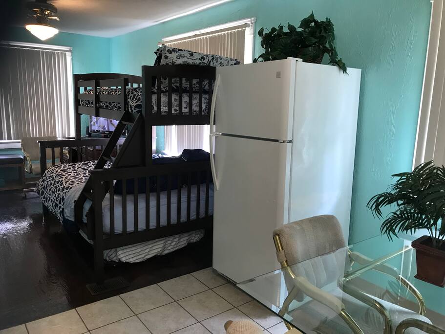 Full (double) bed with Twin on top and Twin pull out below.