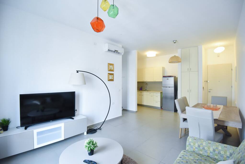 Want to relax after your trip? Grab a drink and enjoy the spacious living room with this large screen satellite TV