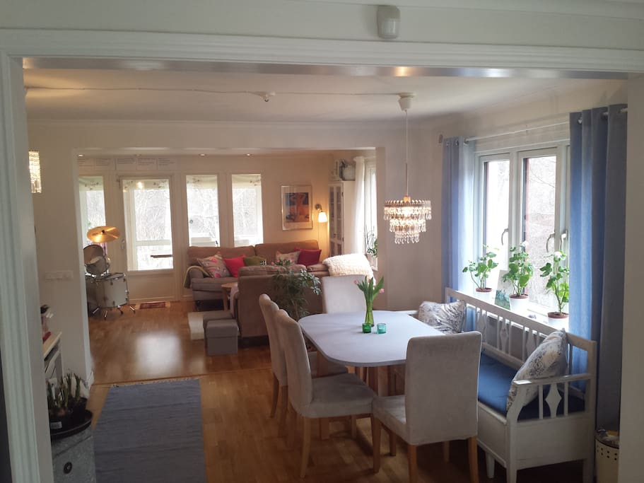 Kitchen, dining room, living room and glass veranda in a suite