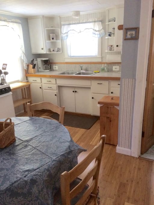 Kitchen, gas stove, full size refrigerator, microwave oven