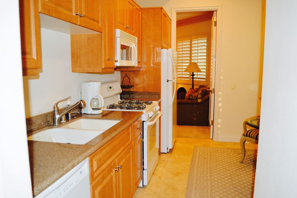 Kitchen: Stove, full size refrigerator, dish washer, sink, microwave, coffee maker, toaster and equipped kitchen.
