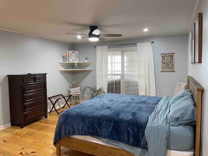 Primary Bedroom. There is a TV on top of the dresser