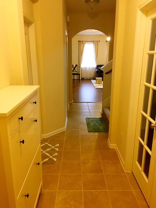 View of the clean, tiled hallway in this brand new, just purchased house. Fully renovated and furnished in a classic style! You will feel right at home!