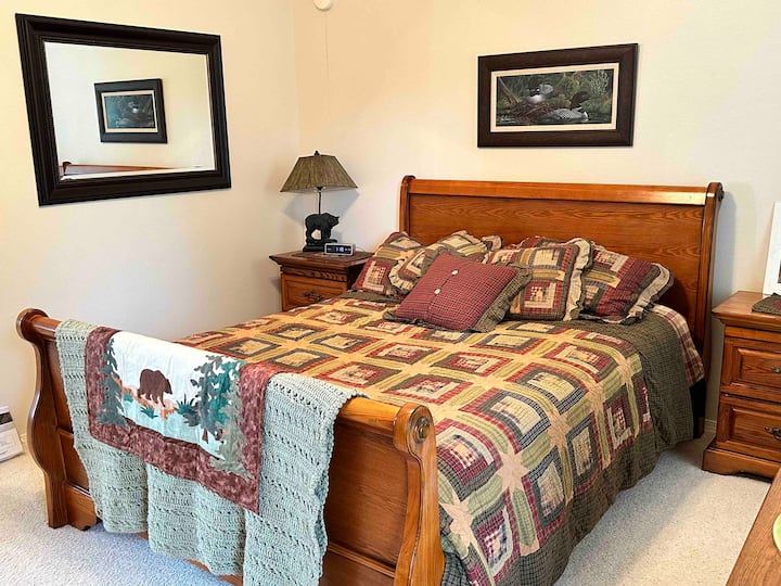 We refer to this Queen bedroom as the Alaska Suite as it features many Alaskan artists and animals that we see here in the area!