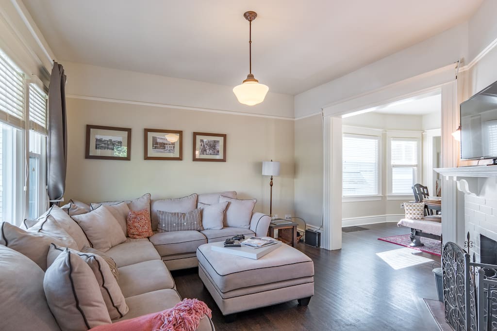 Living room with sectional couch and large front window