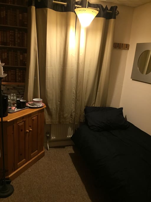 Comfortable single electric bed in this room for those wanting a place to stay in a low budget room.
