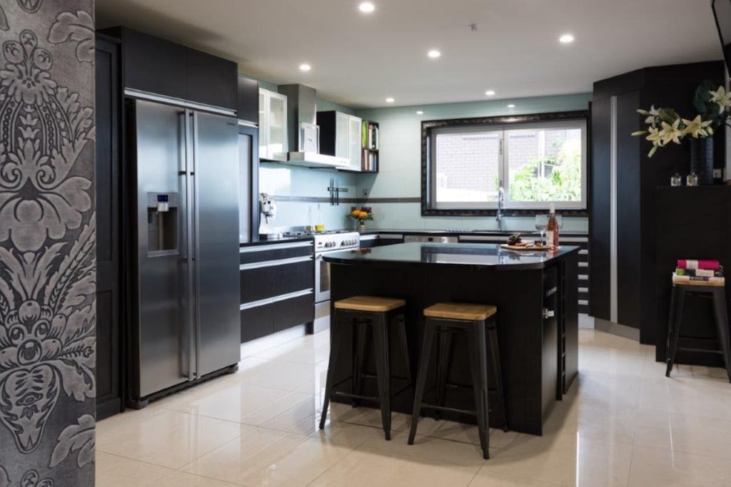 Kitchen with gas hob, ice maker fridge