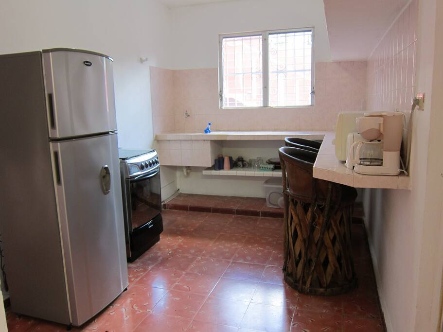 Kitchen with all you need and a big fridge.