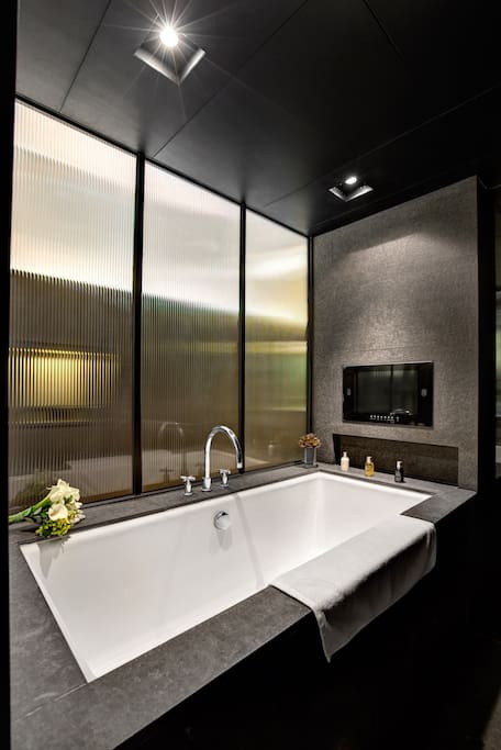 Full-Size Soaking Tub with separate Rain Shower and LCD TV
