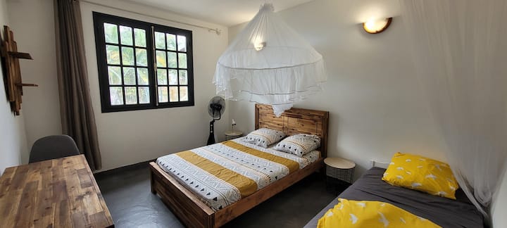 One of the bedrooms on the ground floor  overlooking the terrace and pool 