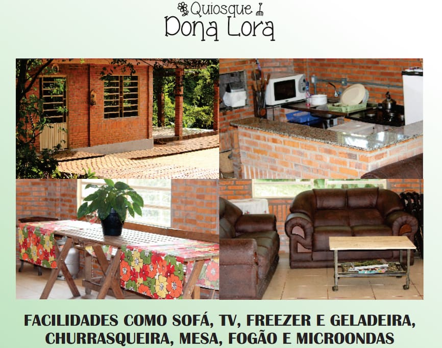 Quiosque com cozinha, churrasqueira, mesa, televisão, forno, micro-ondas, fogão e geladeira.
