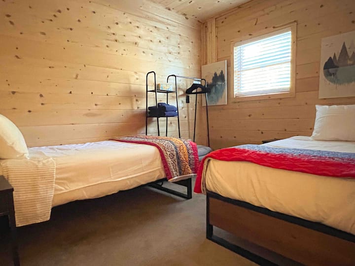 Please note our bedrooms have been rearranged and this room with classic cedar planked walls is now home to a Queen sized beds. Not to worry, twin beds have been relocated to Bedroom 2. New photos to follow.