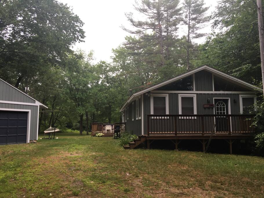 View of the house from the road; outdoor patio, hammock. (Access to garage not included.)