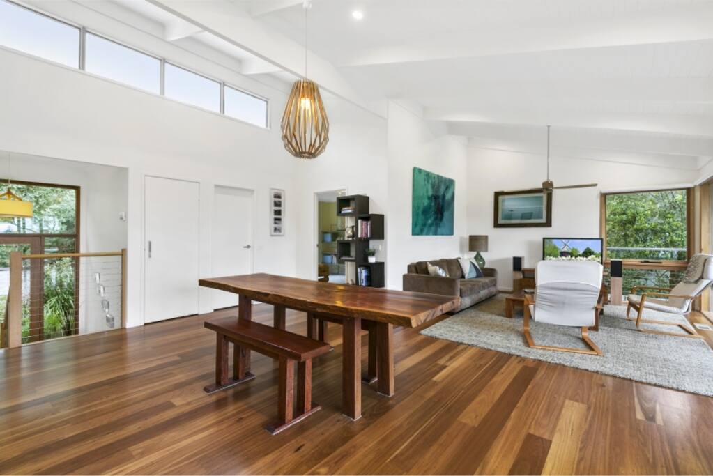 Custom made dining table is a feature of the main living space. (Benches now replaced with seating for 8).