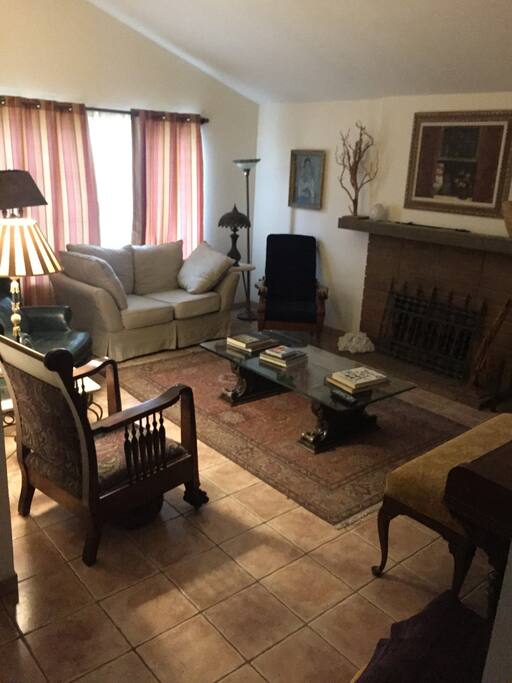 Upon entering, an upright piano and vintage television greet you in the living room for your entertainment, as well as a charming fireplace.