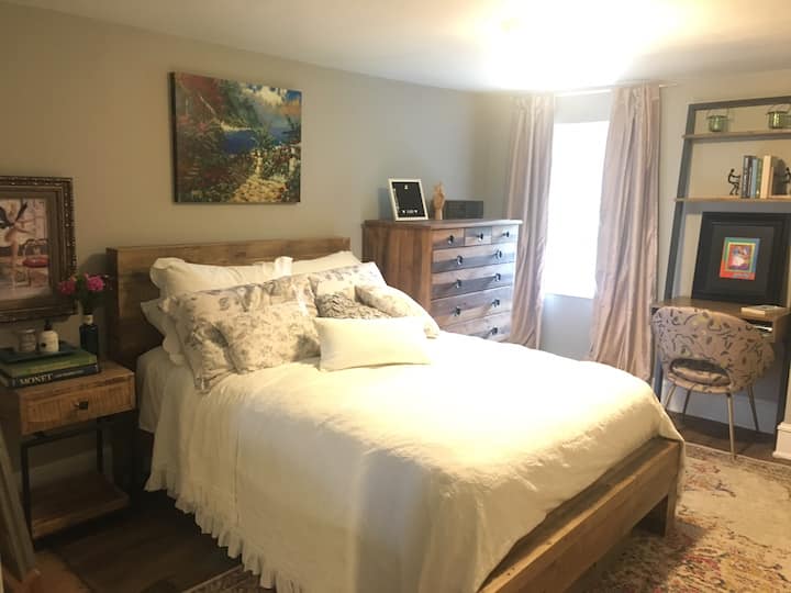 The second guest room has a full size bed and desk space.
