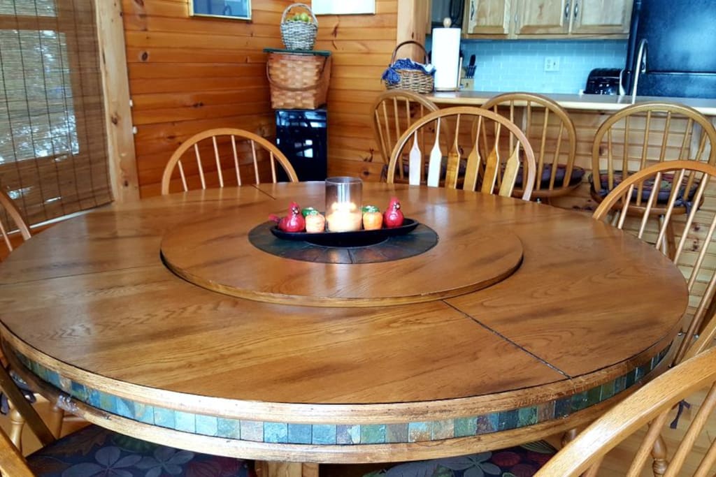 Large slate and hardwood dining table can accommodate 8 .