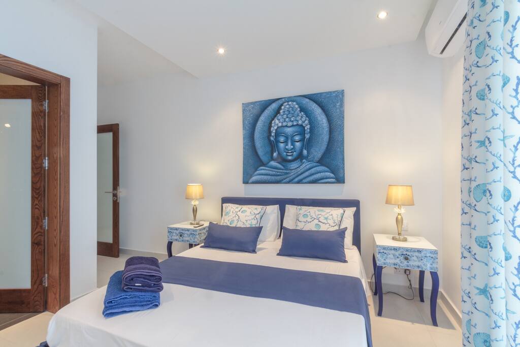 Master bedroom in blue - modern yet home
