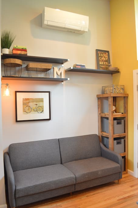 Living area with comfortable seating and view of the flat screen Roku TV