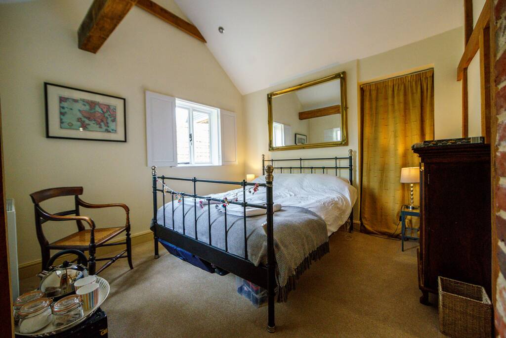 King size bed with tea, coffee and fridge.