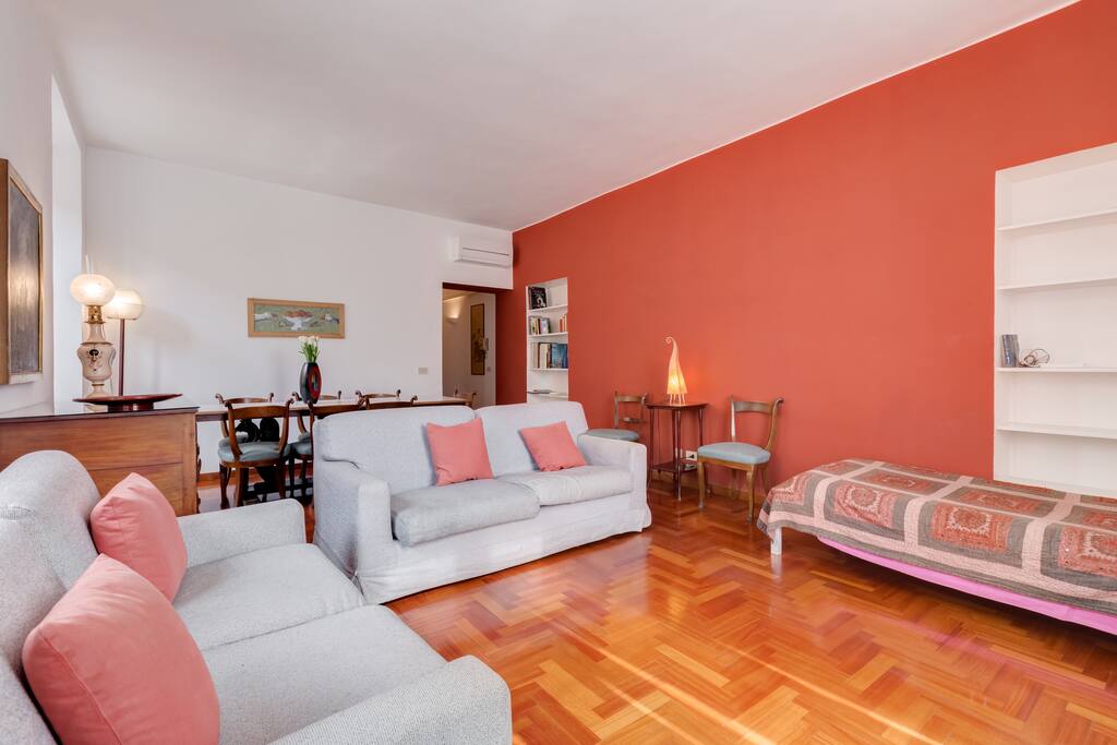 living room with sofas (one is a bed) and single bed