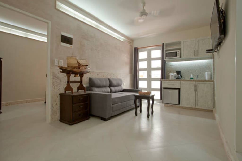 Main living area with balcony - this apartment combines a 1 bedroom apartment with a studio apartment via a lockable ´hotel´ door.