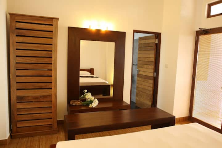 Comfortable bedroom with a large bed and relaxing atmosphere.