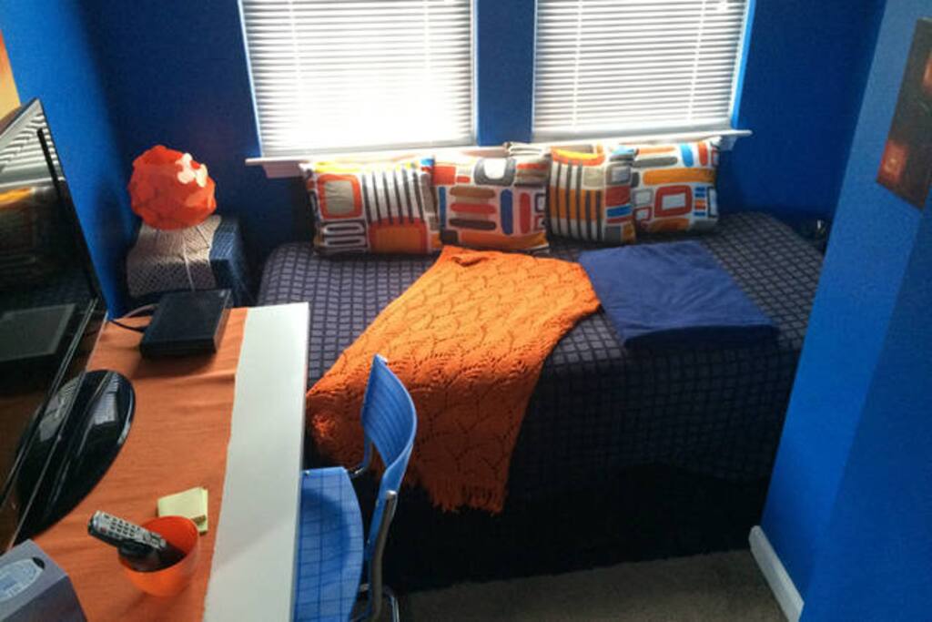 On the other side of the Blue room, a Comfy Sitting Area in the blue bedroom, along with TV