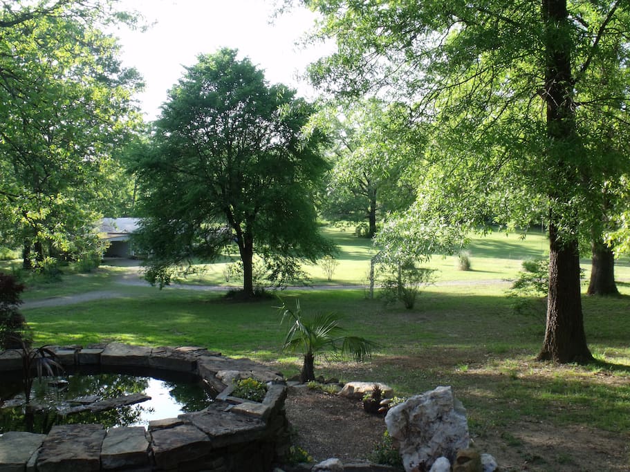 More open areas and stone fountain by The Cabin Retreat