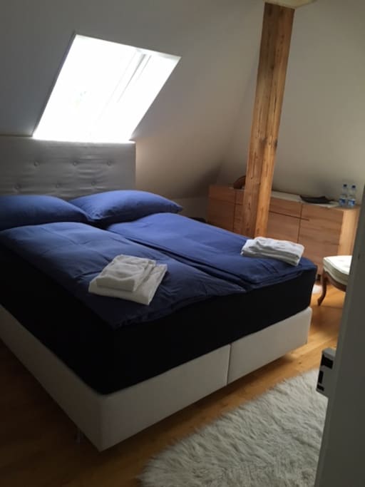 Bedroom 1, set up with two individual down comforters, each of them is 160*200 cm