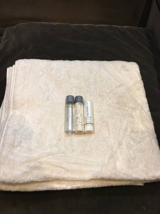 Pictures of the daily complimentary fresh towels and toiletries that we will provide you access to use during you stay