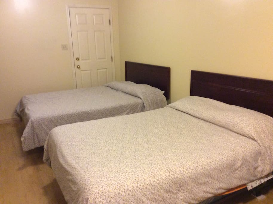 Beds. The door in the background leads to the garage and is permanently locked.