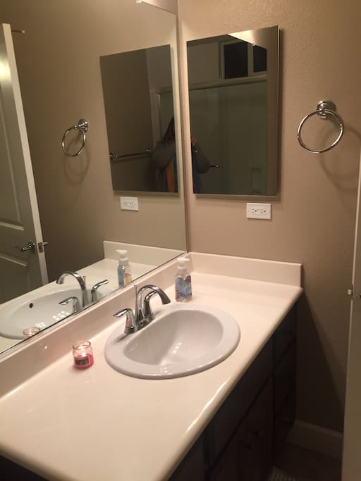 Private attached bathroom with tub shower.