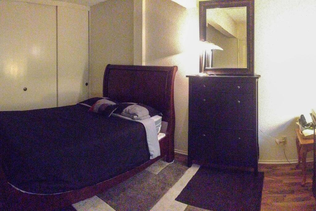 Comfortable Queen bed with closet, shoe cabinet & extra dresser space for use.