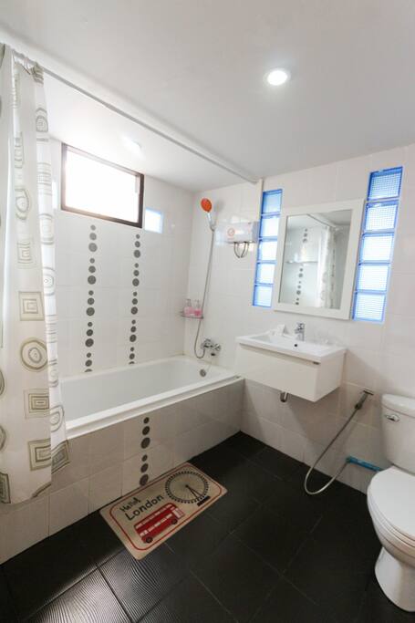 Large private bathroom with bath