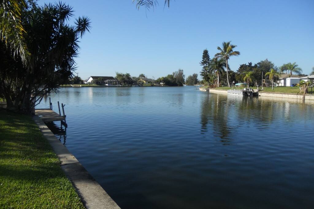 You'll enjoy this beautiful view of the at the back of the home along the seawall, where dazzling sunsets can be seen over the canal.
