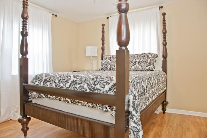 Elegant master bedroom with a king-sized bed, soft linens, and luxurious furnishings. A perfect retreat for relaxing after a long day.

