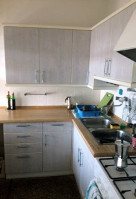 Kitchen equipped with oven and refrigerator