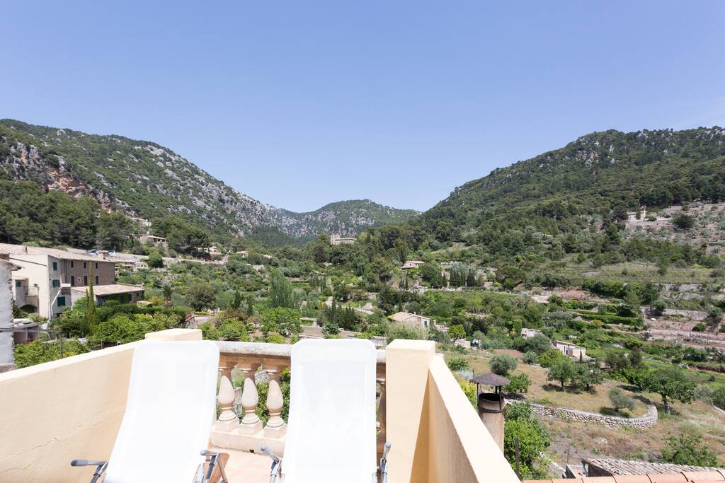 Roof terrace from the upper floor boasts gorgeous views and loungers to soak up the summer rays.