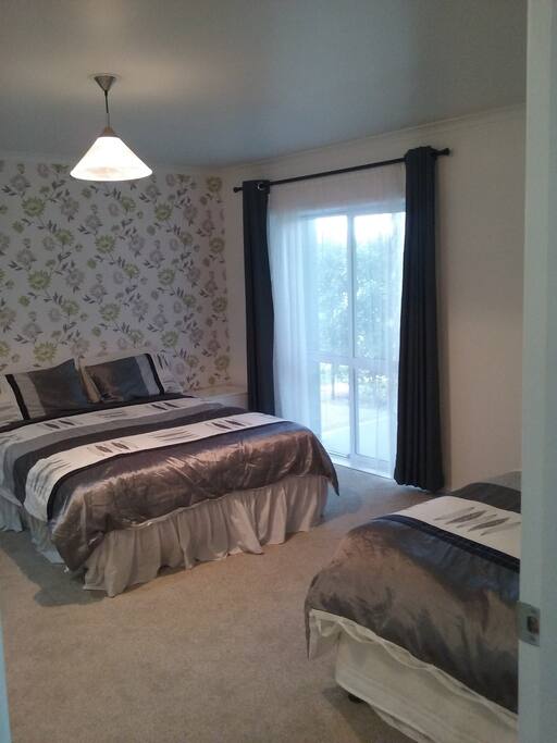 Queen bed and entrance to studio