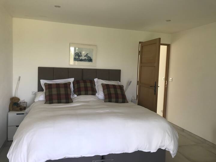 The spacious bedroom with Superking bed on the 1st floor with balcony and countryside views