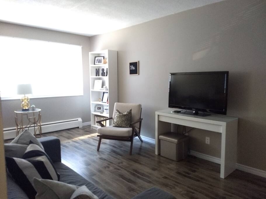 The Livingroom is a bright space with an HD television, a couch and seats.