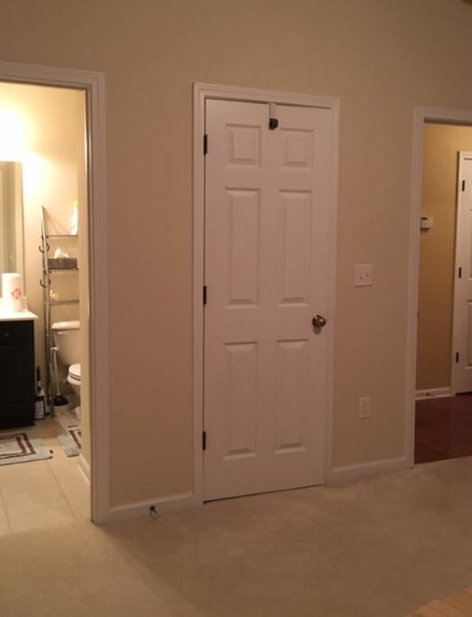 You can see the bathroom on the left. On the right is the interior door that leads to the front hallway and entrance.
