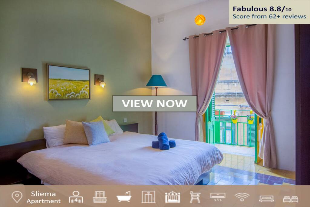 This is the masterbedroom with balcony overlooking the street.