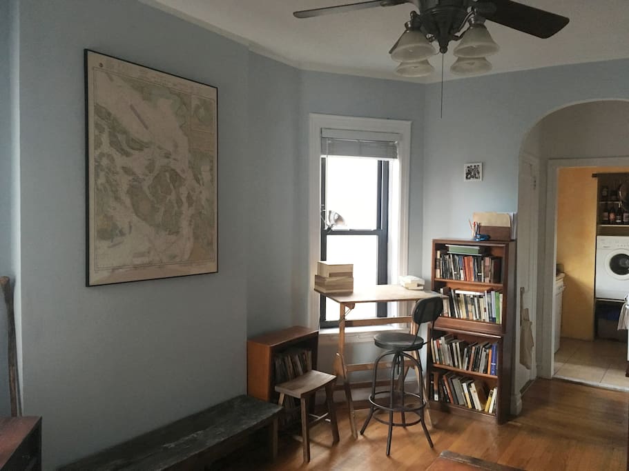 Antique map, tulip poplar bench, bookcases, and oak painting easel