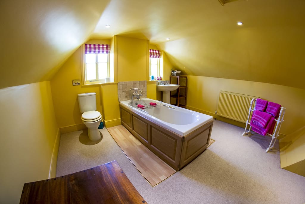 The extremely large en-suite bathroom, bright and airy.