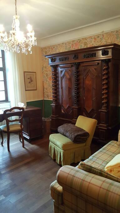 sleeping-room with desk, cupboard and sofa