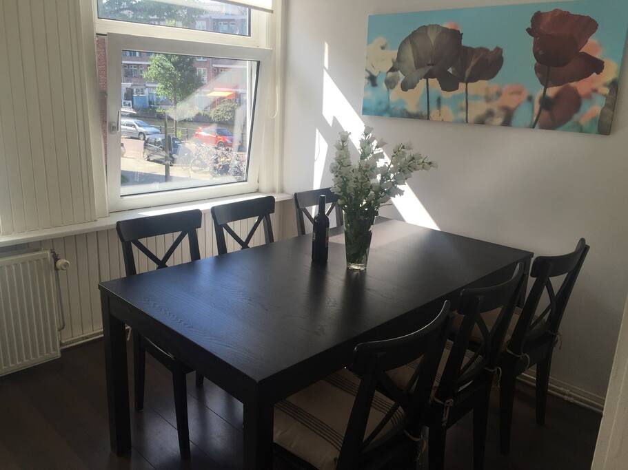 The dining table fits 6 persons comfortably and overlooks at a canal.