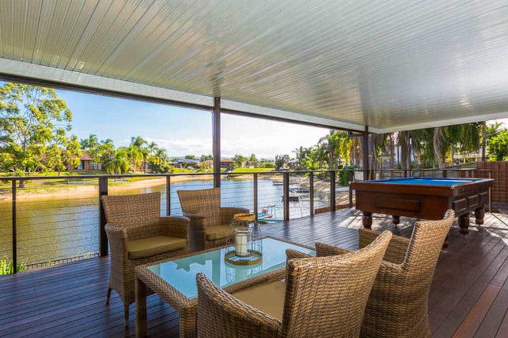 Huge completely sheltered rear deck overlooking the water. Pool table, BBQ, dining and sitting areas.